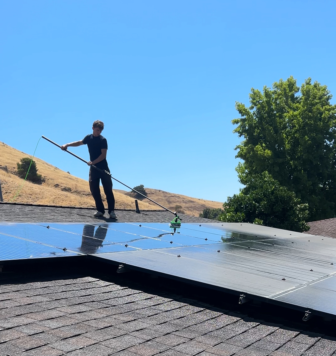 Solar panel cleaning on a Bay Area rooftop